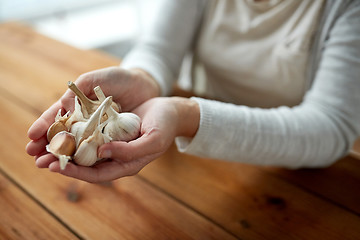 Image showing woman hands holding garlic