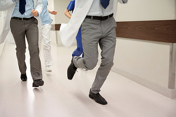 Image showing close up of medics or doctors running at hospital