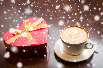 Image showing close up of gift box and coffee cup on table