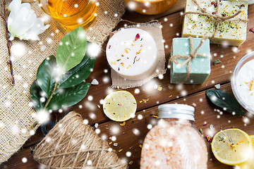 Image showing natural body care cosmetics on wood