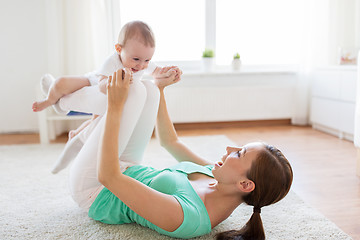 Image showing happy mother playing with baby at home