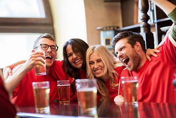 Image showing football fans or friends with beer at sport bar