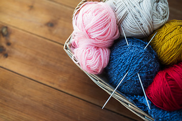 Image showing basket with knitting needles and balls of yarn