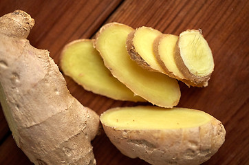 Image showing close up of ginger root on wooden table