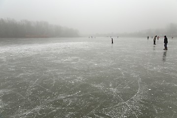 Image showing Skating on frozen lake