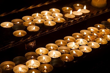 Image showing Candles in a dark church