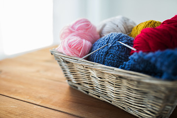 Image showing basket with knitting needles and balls of yarn