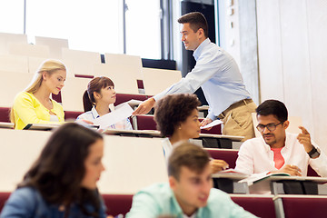 Image showing teacher giving test to students on lecture