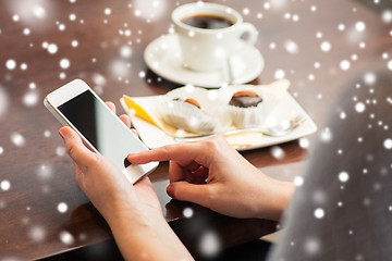 Image showing woman with smartphone, coffee and dessert