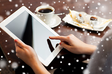 Image showing close up of woman with tablet pc and coffee