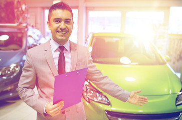 Image showing happy man at auto show or car salon