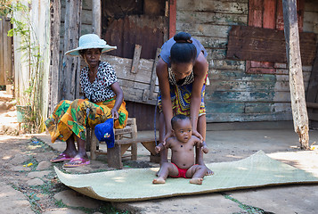 Image showing Malagasy woman with baby resting in shadow, Madagascar