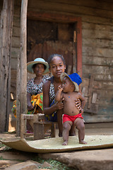 Image showing Malagasy woman with baby resting in shadow, Madagascar