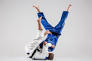 Image showing The two judokas fighters fighting men