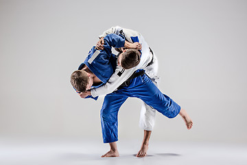 Image showing The two judokas fighters fighting men