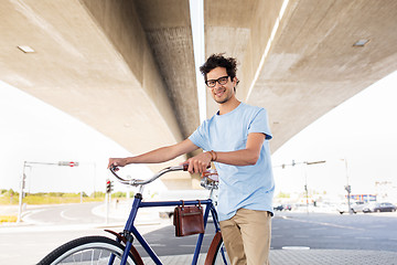 Image showing hipster man with fixed gear bike under bridge