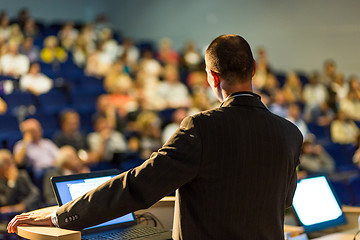 Image showing Public speaker giving talk at business event.