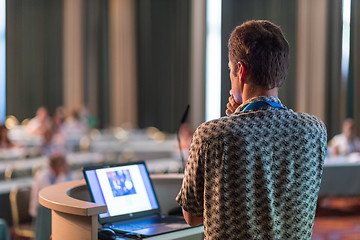 Image showing Public speaker giving talk at scientific conference.