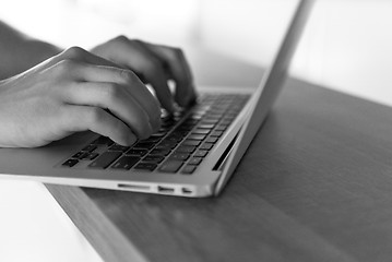 Image showing close up of male hands while working in modern office