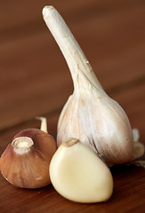Image showing close up of garlic on wooden table
