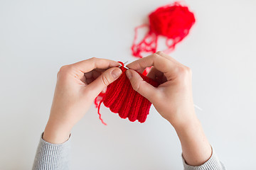 Image showing woman hands knitting with needles and yarn