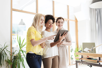 Image showing happy creative team with tablet pc in office