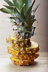 Image showing Sliced pineapple on plank