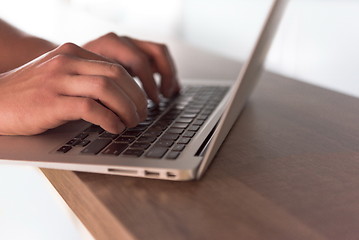 Image showing close up of male hands while working in modern office