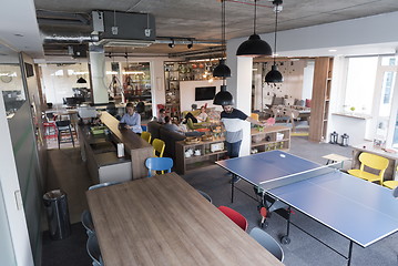 Image showing playing ping pong tennis at creative office space