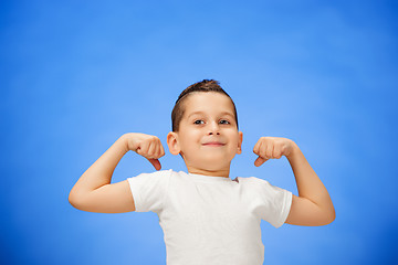 Image showing Beauty smiling sport child boy showing his biceps