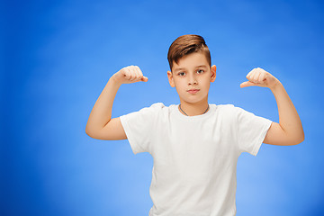 Image showing Beauty smiling sport child boy showing his biceps