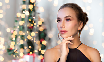 Image showing beautiful woman in black wearing diamond jewelry