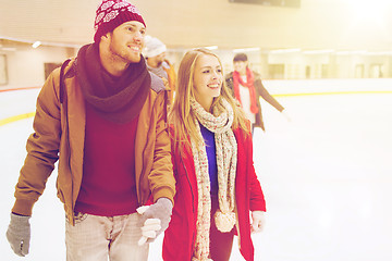 Image showing happy friends on skating rink