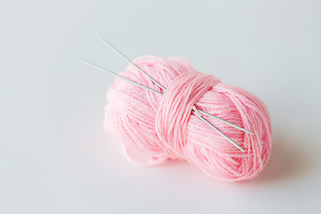 Image showing knitting needles and ball of pink yarn