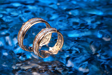 Image showing Golden Rings In The Water