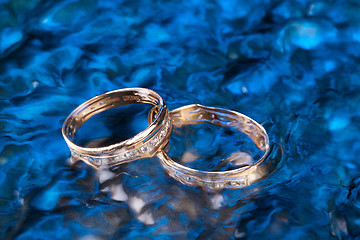 Image showing Golden Rings In The Water