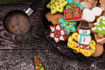 Image showing Gingerbreads and coffee for new years or christmas