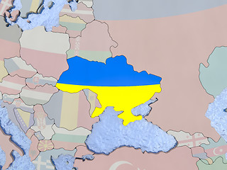 Image showing Ukraine with flag on globe