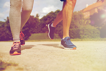 Image showing close up of couple running outdoors