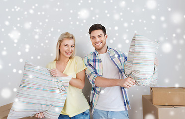 Image showing happy couple pillows moving to new home