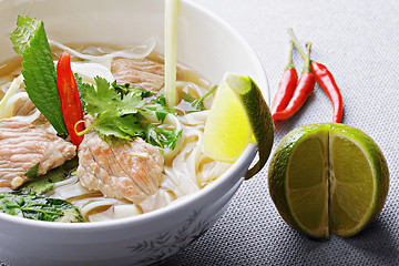 Image showing Pho bo soup with lime and chili closeup