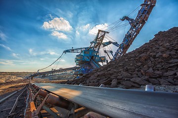 Image showing Long conveyor belt transporting ore