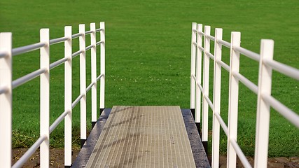Image showing White fence on path
