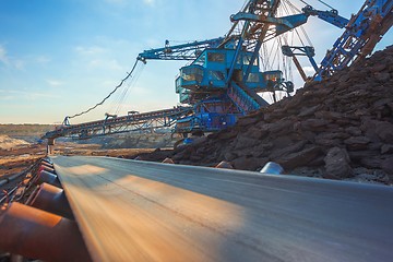 Image showing Long conveyor belt transporting ore