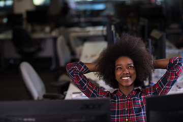 Image showing young black woman at her workplace in modern office  African-Ame