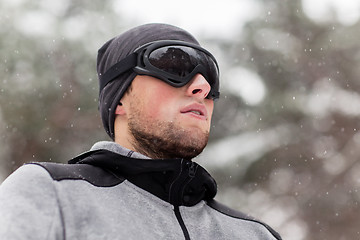 Image showing sports man with ski goggles in winter outdoors