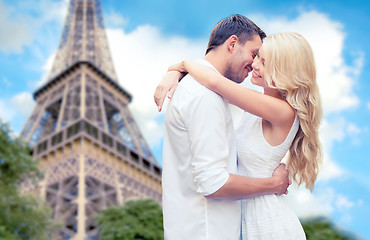 Image showing happy couple hugging over eiffel tower