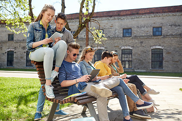 Image showing group of students with tablet pc at school yard