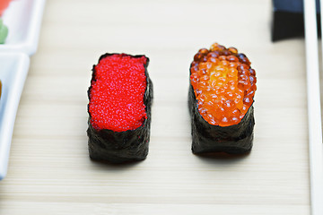 Image showing Tobiko and Ikura sushi on table