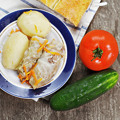 Image showing Cabbage rolls with tomato and cucumber